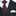 Black suit with a brown patterned tie and beige pocket square