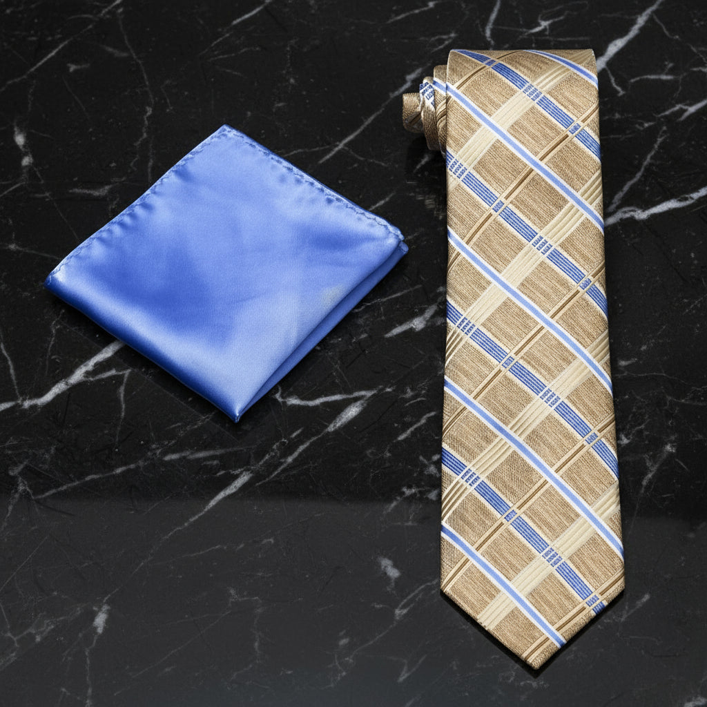 Beige plaid tie and blue pocket square on a black marble surface