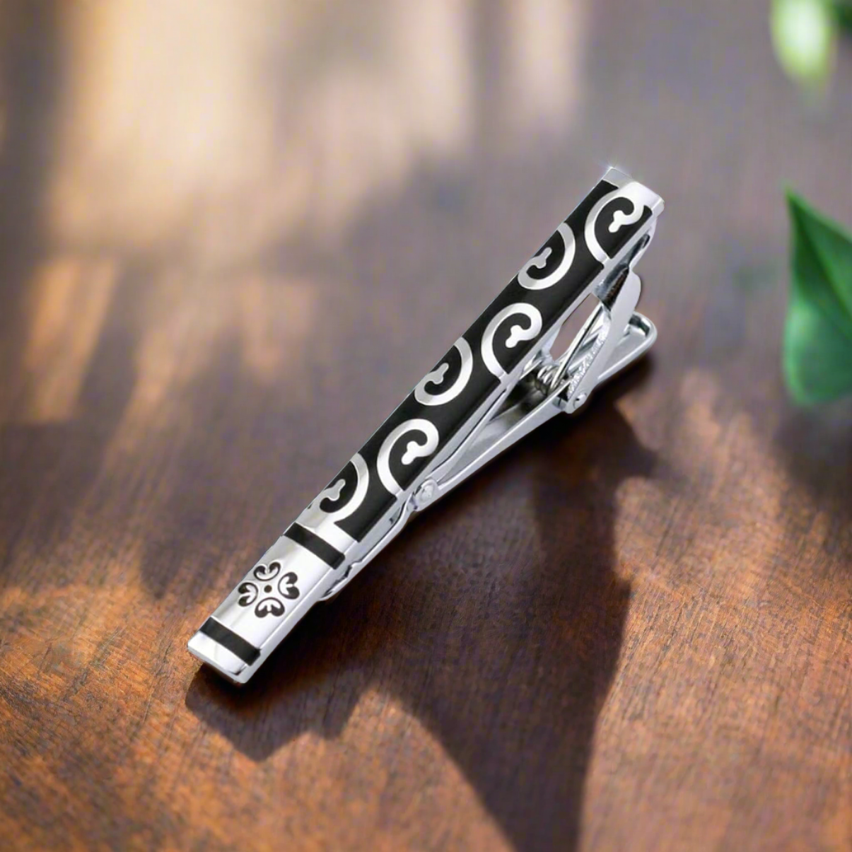 A Black Chrome intricate vine tie bar