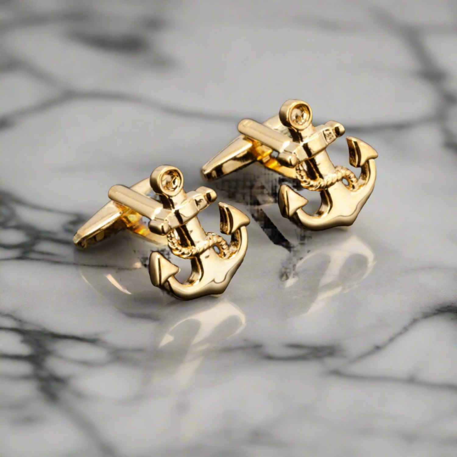 a gold anchor cufflinks