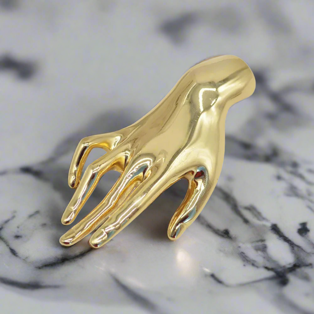 A Gold Hand Lapel Pin