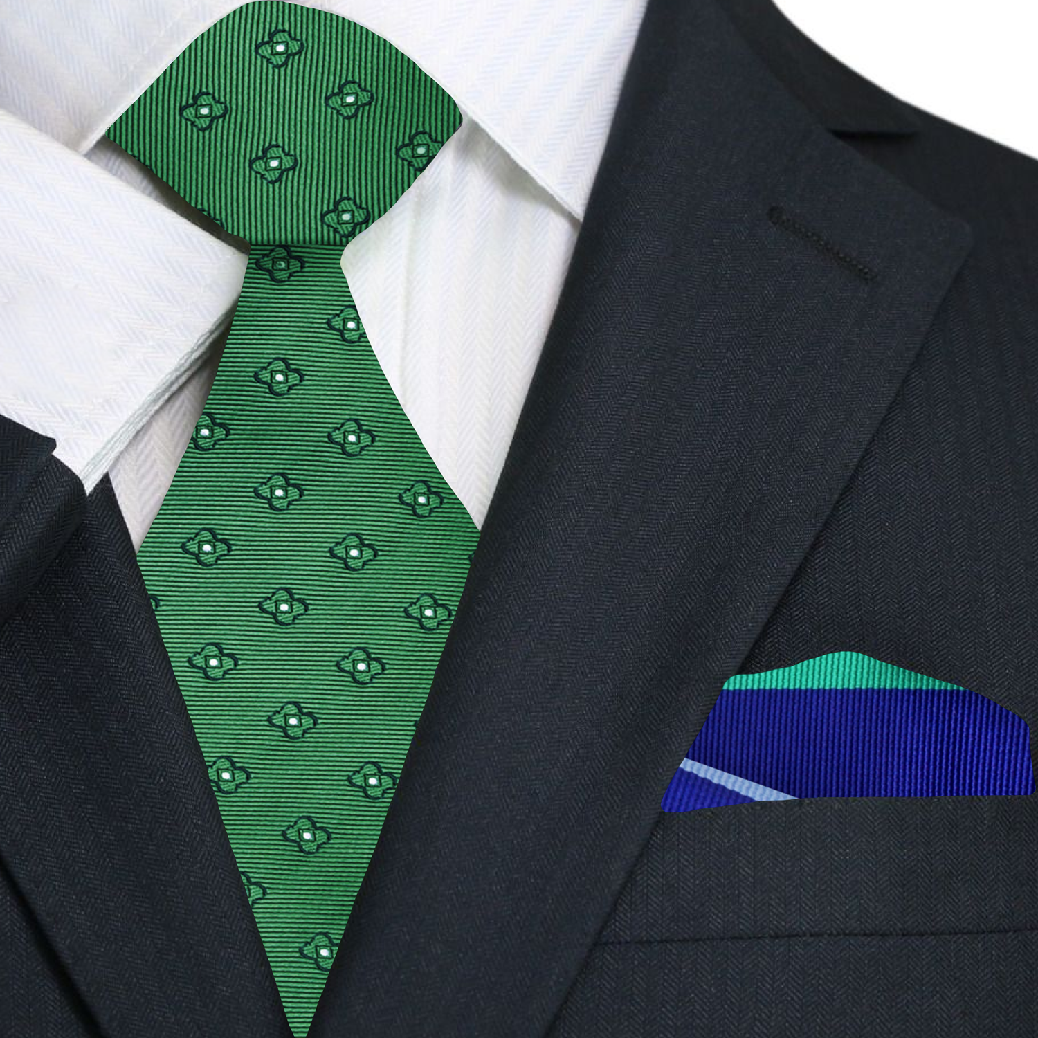 Green patterned tie and blue pocket square on a black suit jacket
