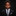 Young boy in a suit and tie against a black background