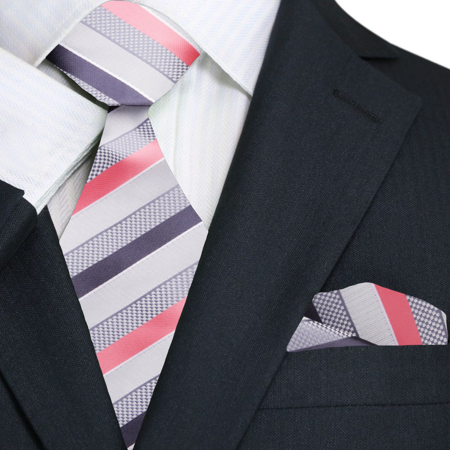 Navy suit with a striped charcoal and pink tie and matching pocket square on a white background