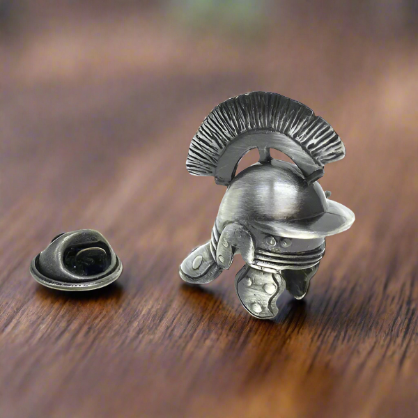 a small helmet lapel pin