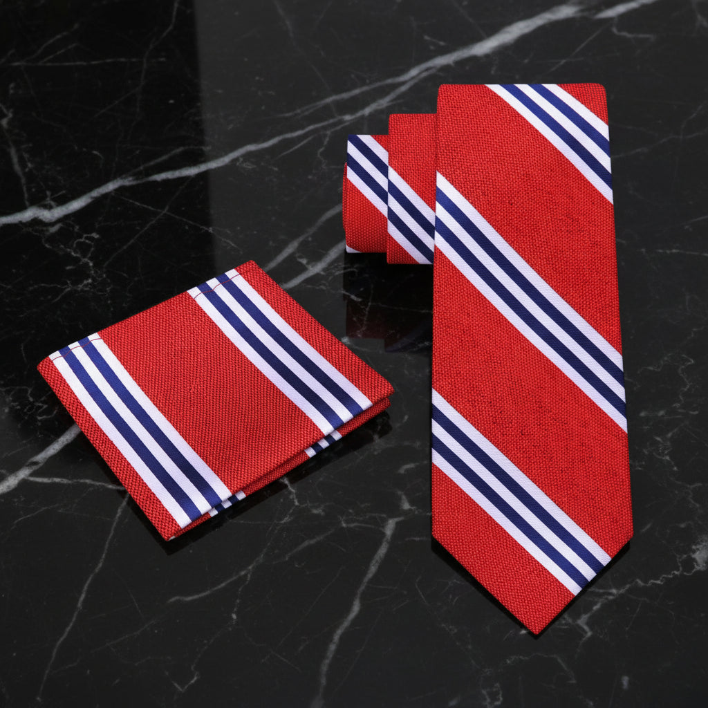 Red tie with blue and white stripes and matching pocket square on a white background