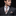 Man wearing nice suit with brown blocks tie and square 