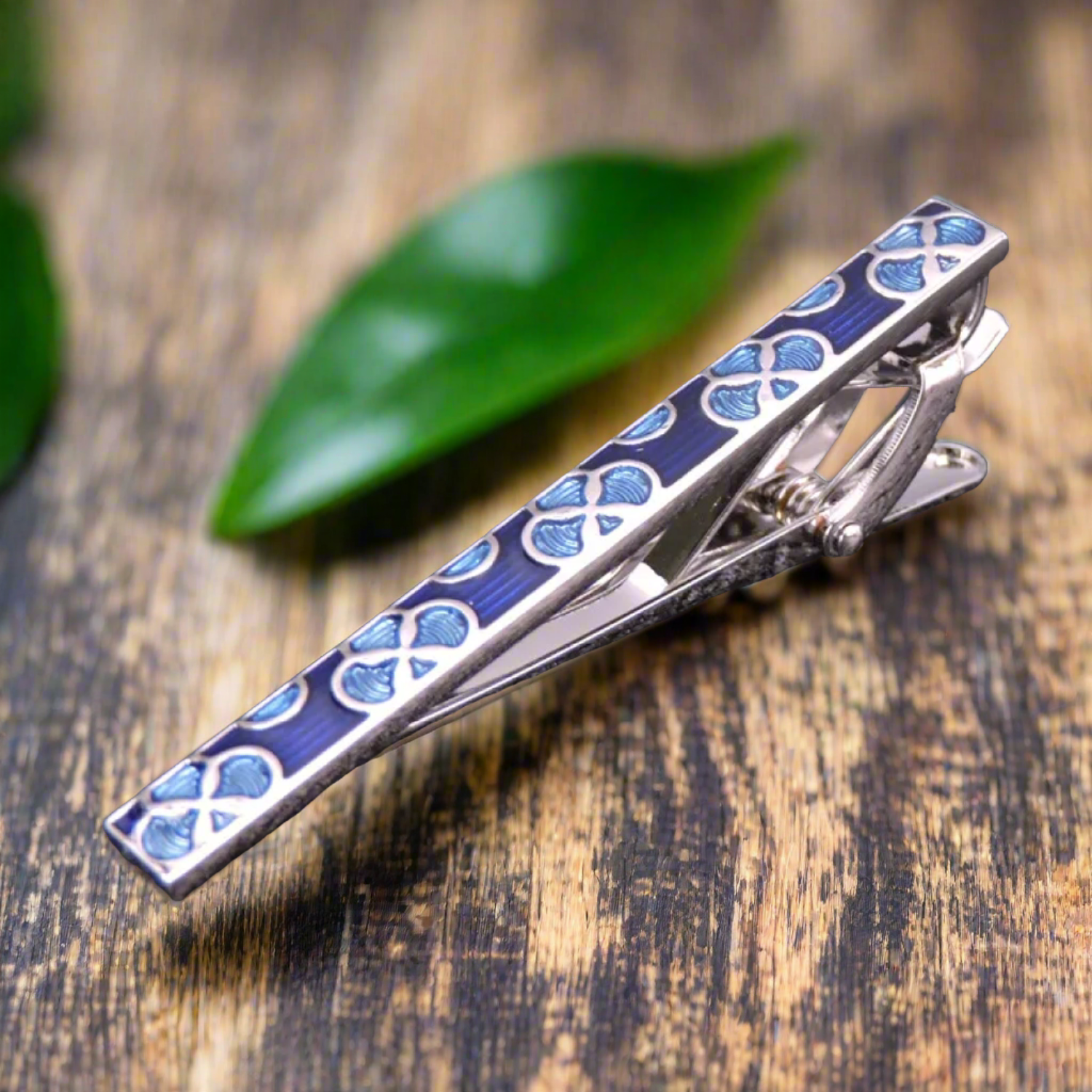 A Blue, Teal Lily Pad Shaped Tie Bar