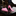Pink thin tie and matching pocket square on a black suit jacket