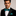 Man wearing suit and bow tie with square