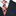 Navy suit with a plaid orange tie and blue pocket square