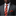 Man wearing a gray suit with a red and black striped tie and pocket square on a black background