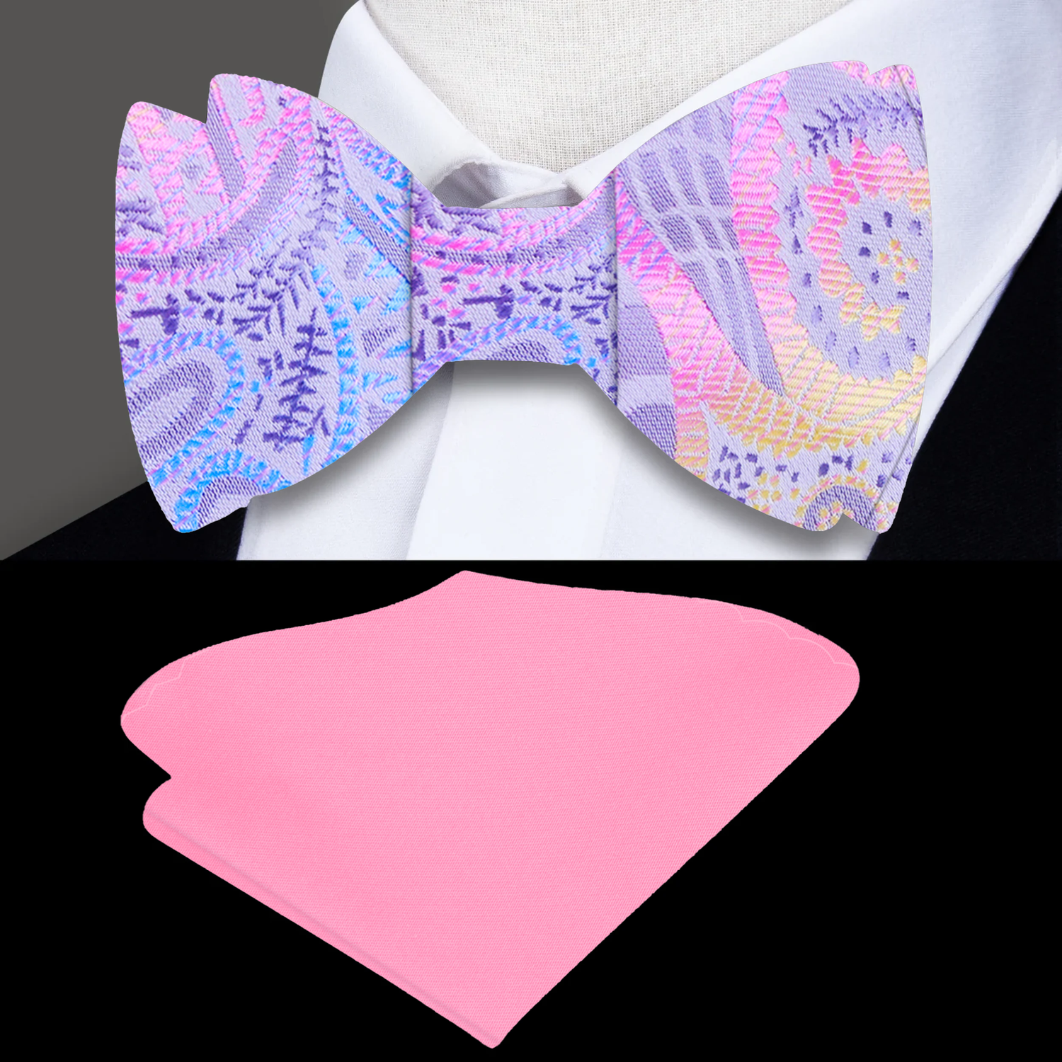 A Pink, Grey, Light Blue, Yellow Paisley Pattern Silk Self Tie Bow Tie and Accenting Pink Pocket Square On Suit