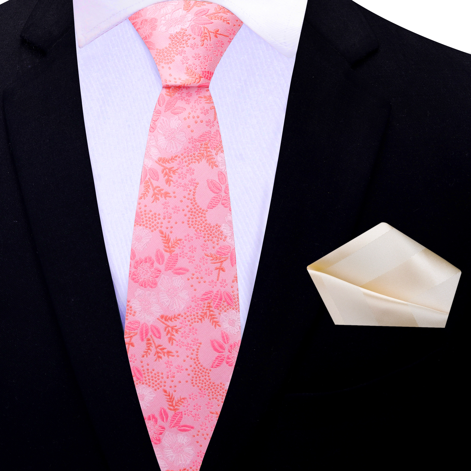 Black suit with a pink floral thin tie and white pocket square on a white background