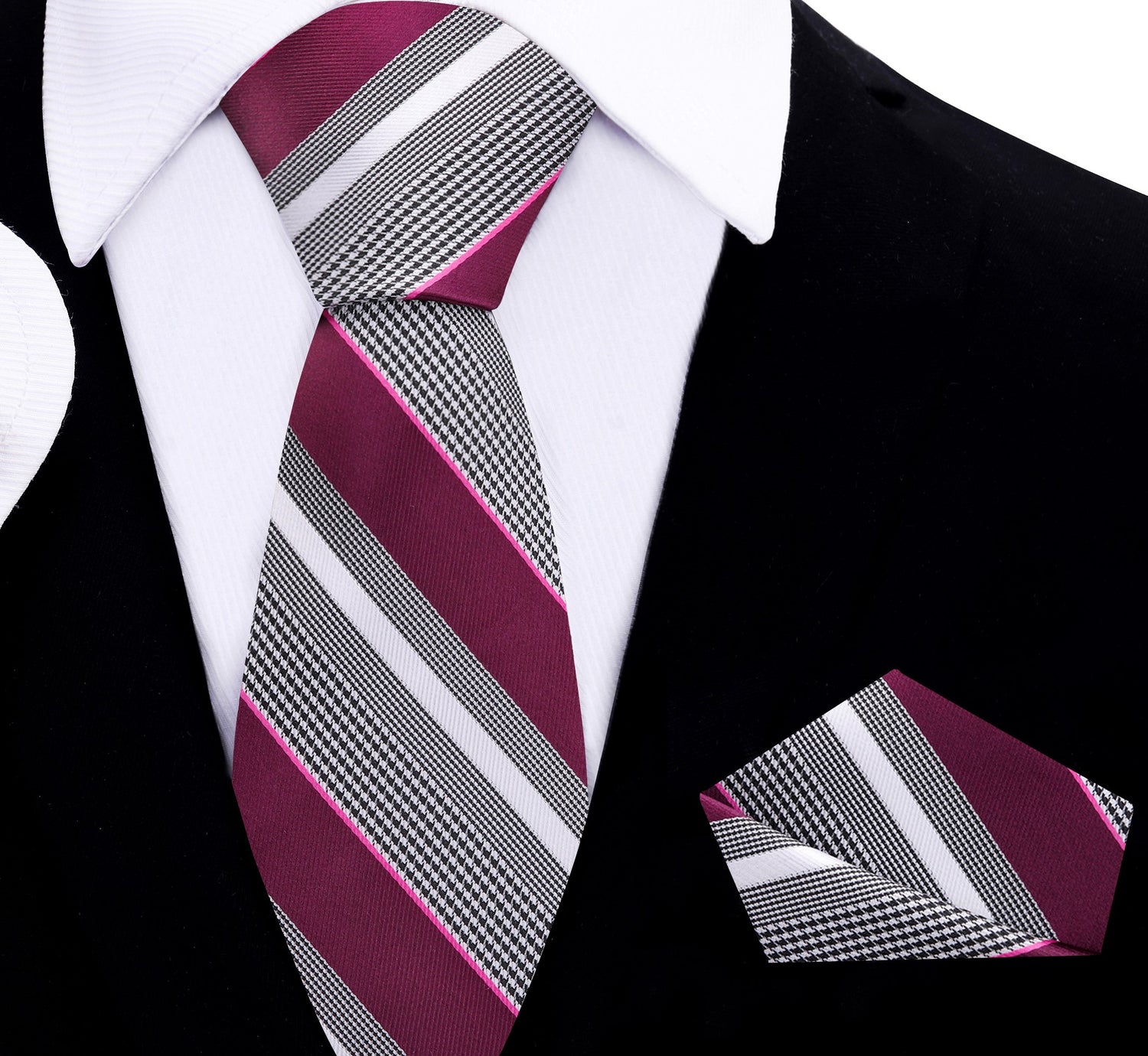 Striped plum black and white tie and pocket square set on a black suit background
