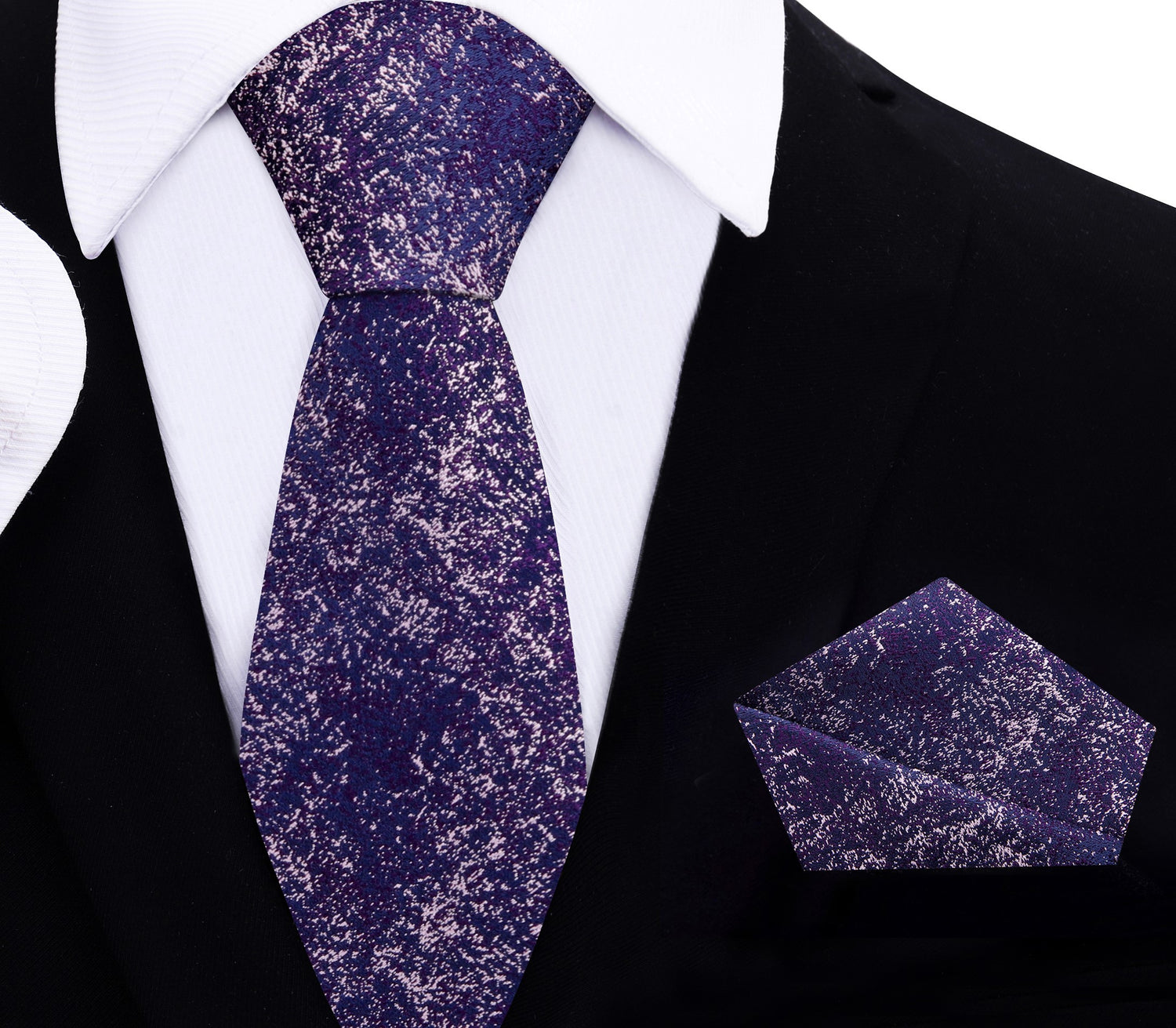 Purple patterned thin tie and matching pocket square on a black suit with white shirt.