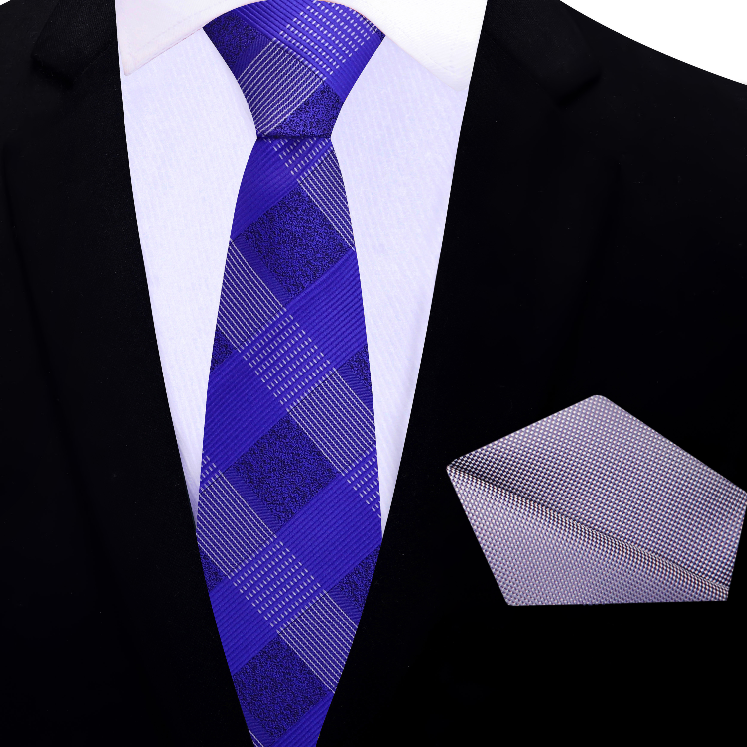 purple plaid thin tie and grey pocket square on a black suit jacket.