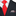 Black suit with a red patterned tie and a patterned pocket square.