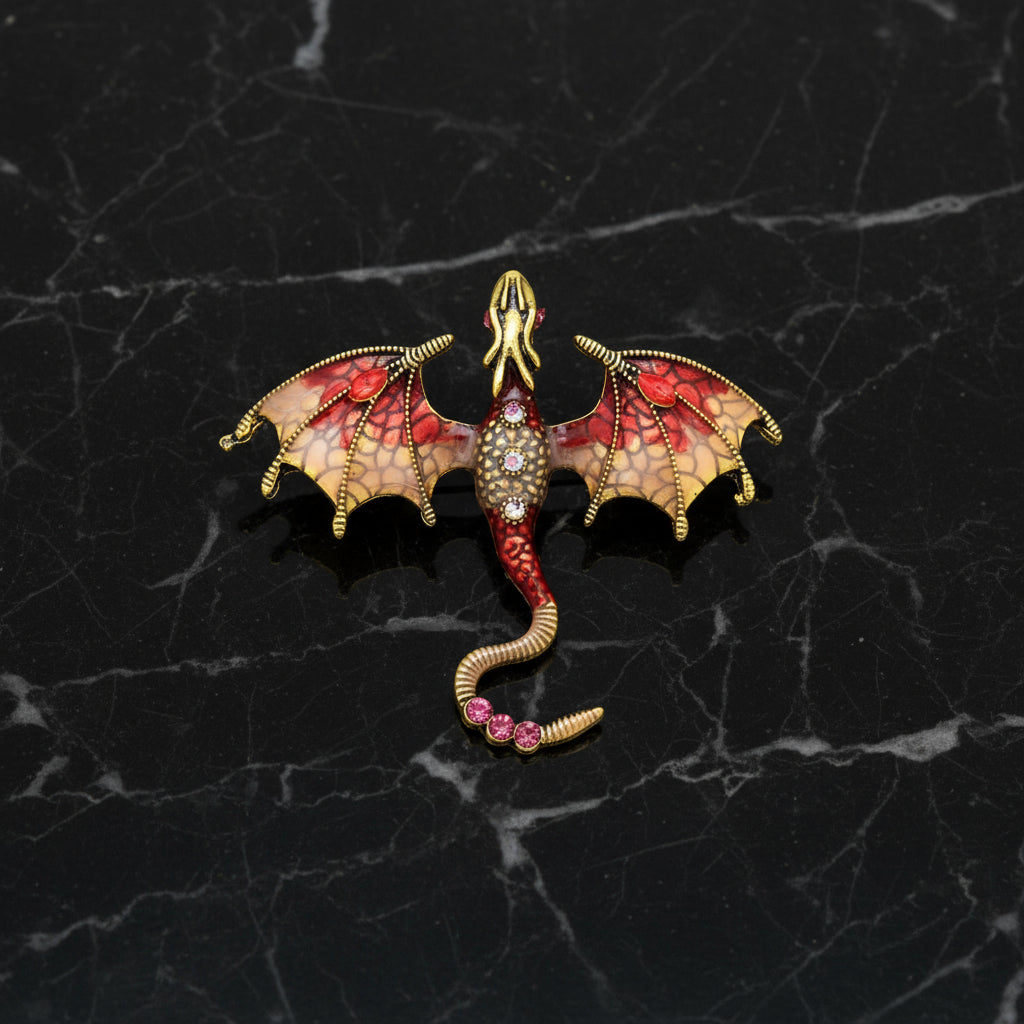 Dragon-shaped earring with red and gold colors on a white background