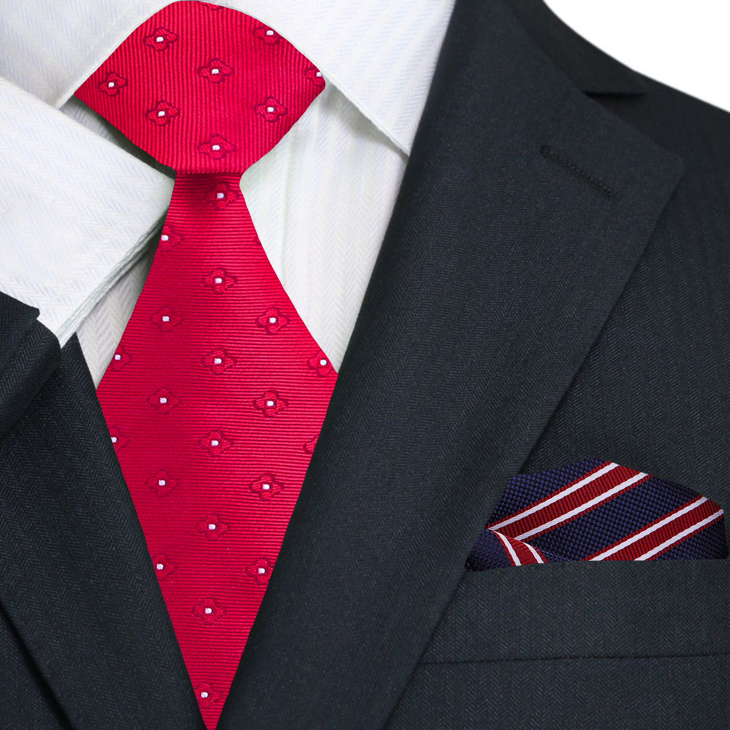 Red patterned tie and matching pocket square on a black suit jacket.