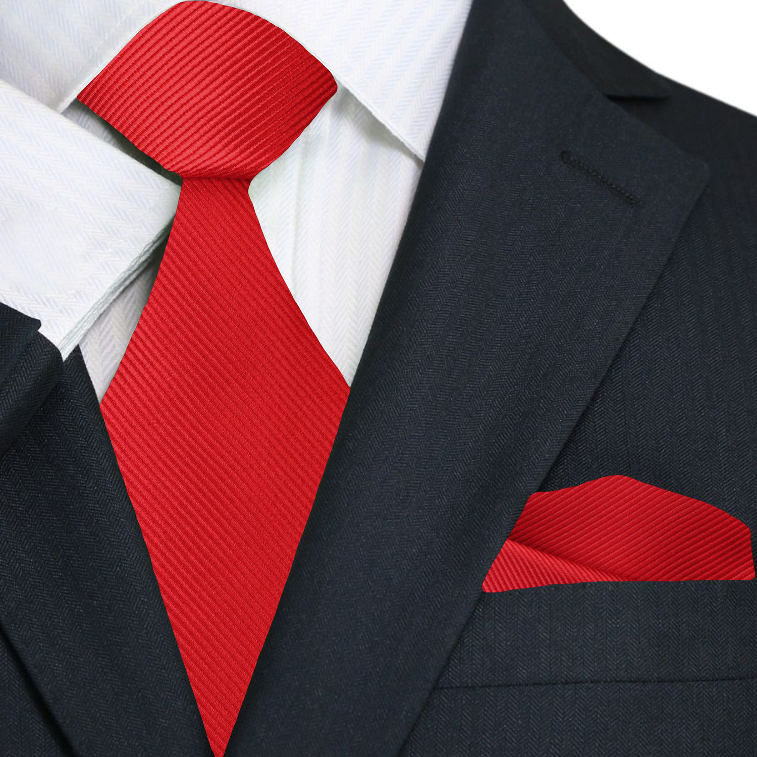 Black suit with a red tie and matching pocket square on a white background