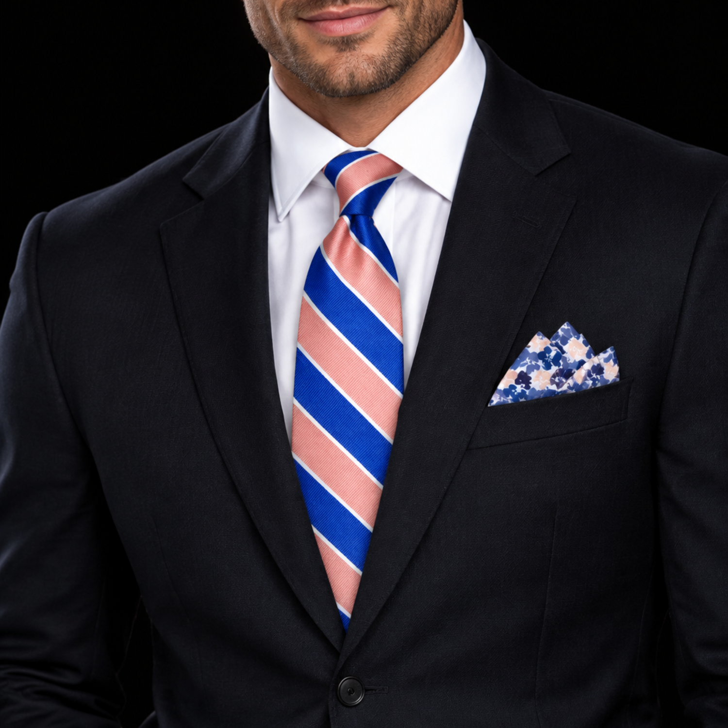 A men's necktie and matching pocket square set on a plain white background. The necktie features bold diagonal stripes in royal blue, pink, and thin white lines.