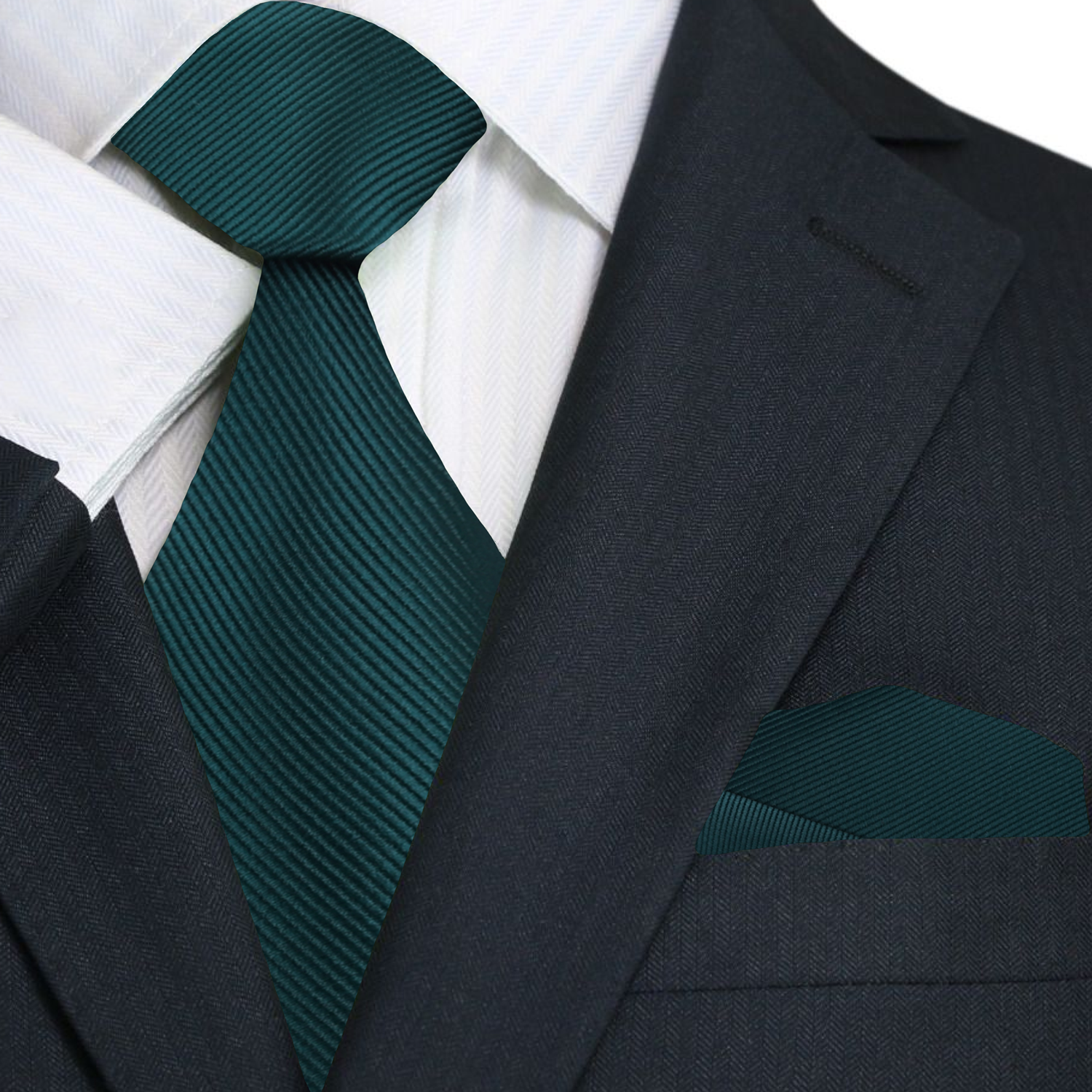 Dark suit with white shirt and green tie and pocket square