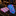 A men's necktie and matching pocket square set displayed on a dark marble surface in a luxury retail setting. The pocket square is folded in pink with blue and black stripes, while the necktie is rolled to show a vibrant blue, pink, and green floral pattern.