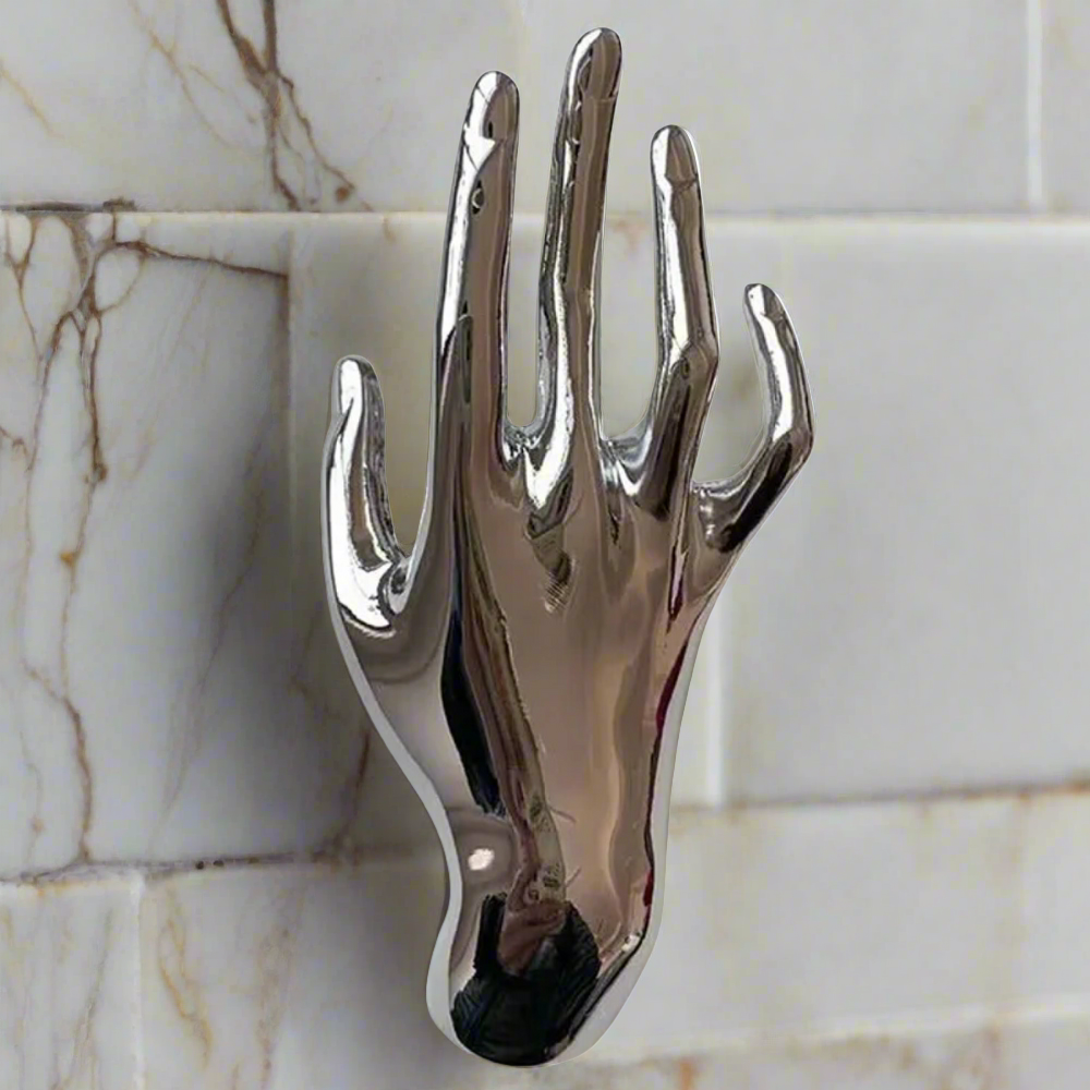 A Silver Hand Lapel Pin