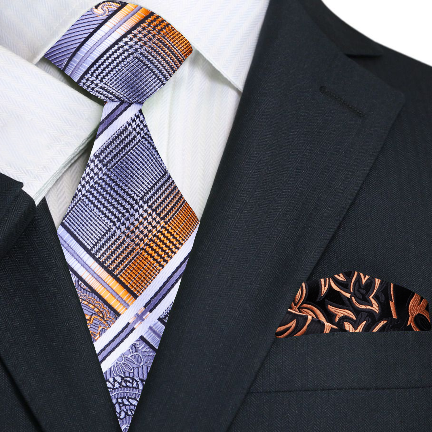Black suit with patterned tie and pocket square on a white background