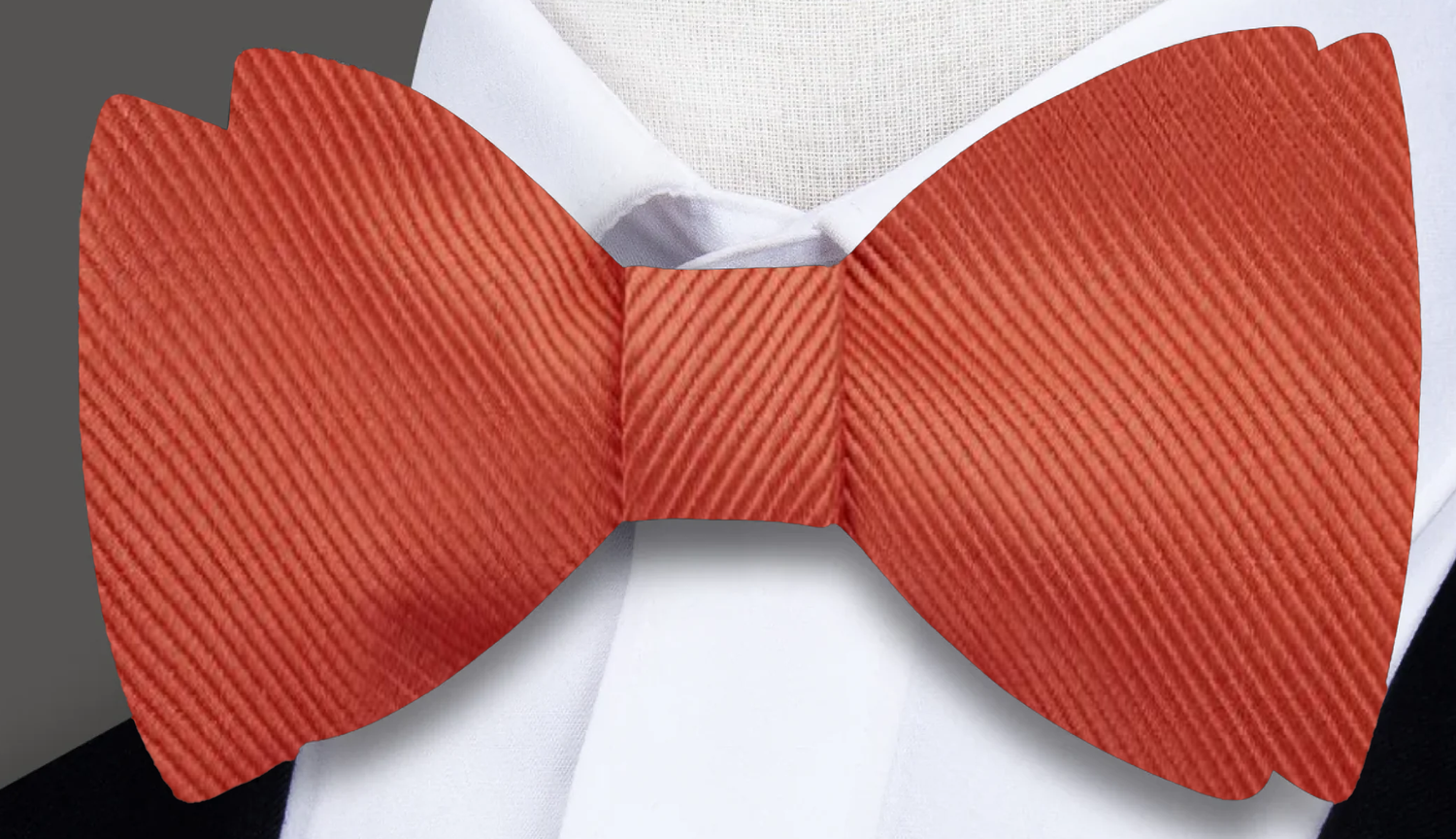 An Orange Solid Pattern Silk Self Tie Bow Tie