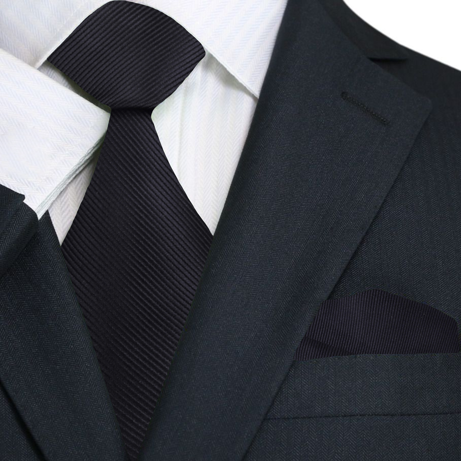 Black suit jacket, white shirt, and black tie on a white background