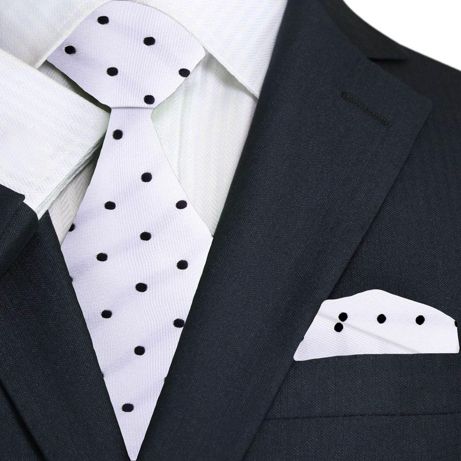 Black suit with white shirt, polka dot tie, and matching pocket square.