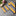 Set of yellow and gray striped ties on a grey background