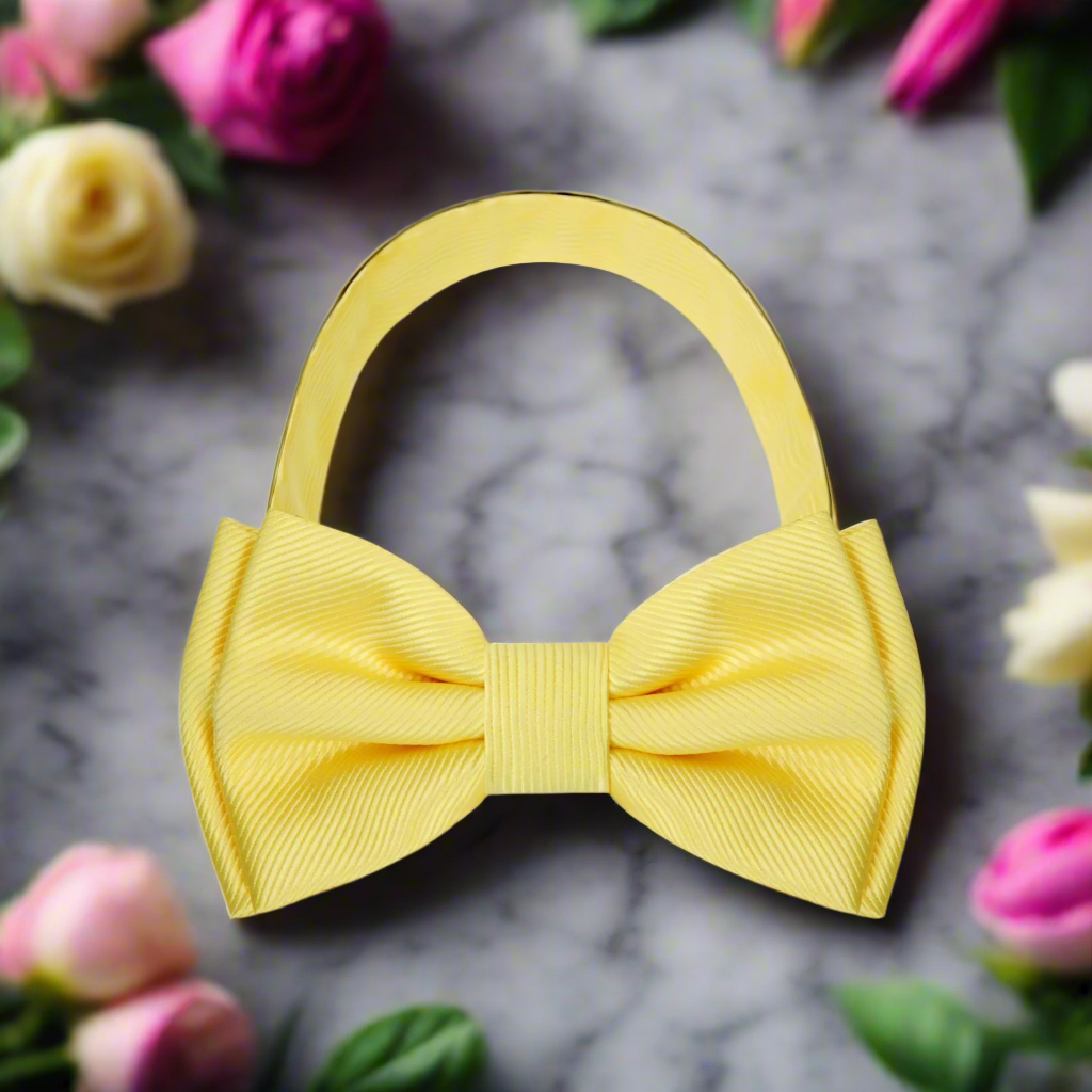 A solid yellow pre tied bow tie