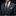 Man wearing a gray suit with a patterned tie and pocket square on a black background