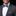 grey suit with a blue and purple stripe bow tie and pocket square