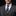 Man wearing a gray suit with a patterned tie and pocket square on a black background