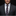 Man wearing a navy suit with a plaid tie and pocket square on a gray background