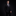 Man wearing a black suit with a purple tie against a dark background