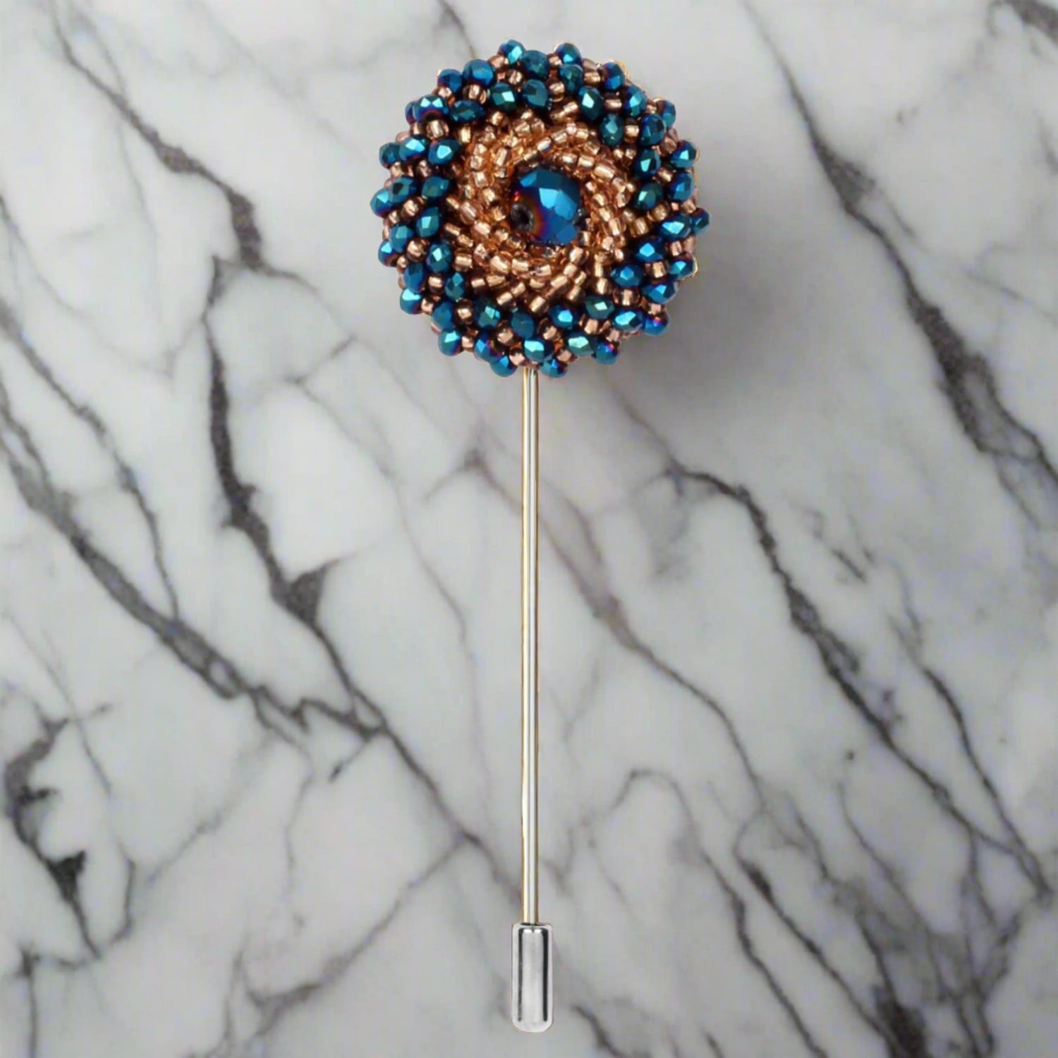 A Blue, Gold Colored Swirl Gemstone Lapel Pin||Blue, Gold Swirl