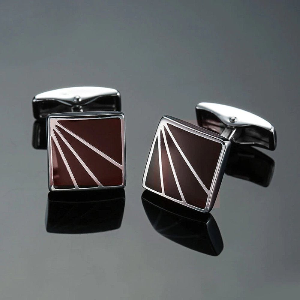 A Mahogany and Chrome Rays of Light Shaped Cuff-links