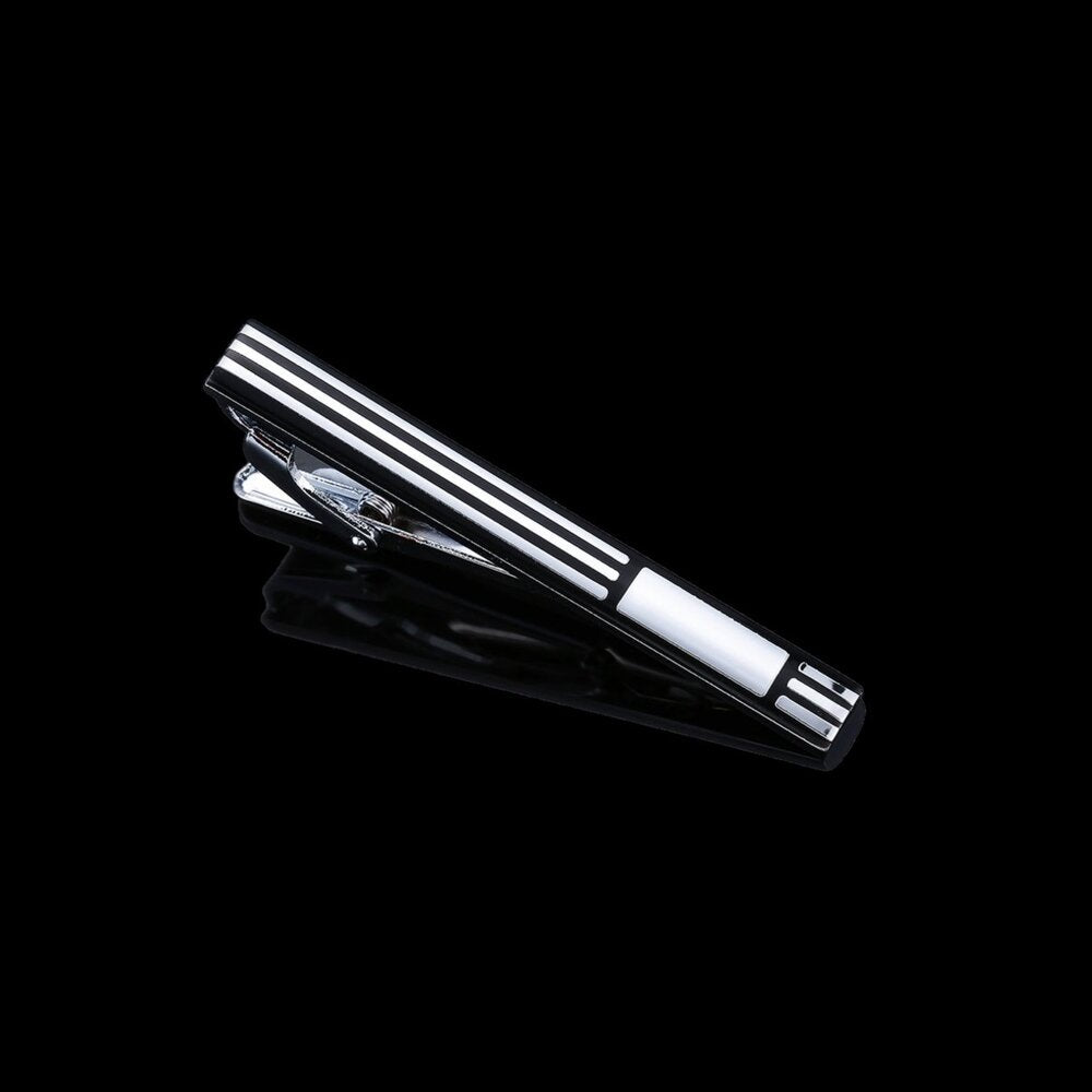A Chrome, Black Colored Lined Pattern Tie Bar