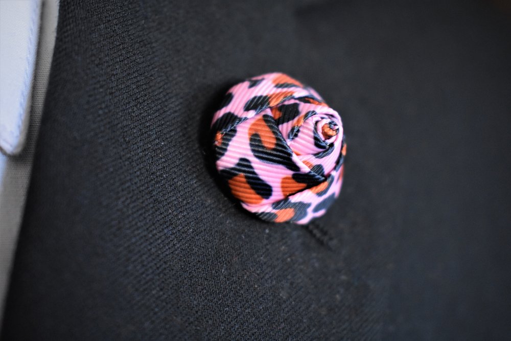A Pink, Black, Orange Leopard Pattern Lapel Bud Flower