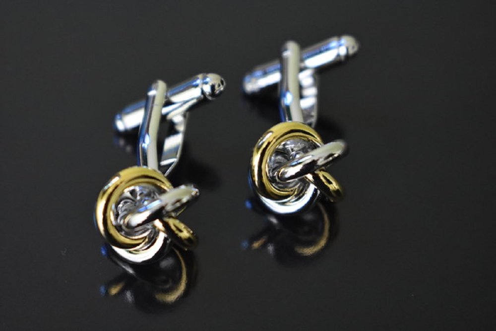 A thin gold silver knot cuff-links||Gold/Silver Rings
