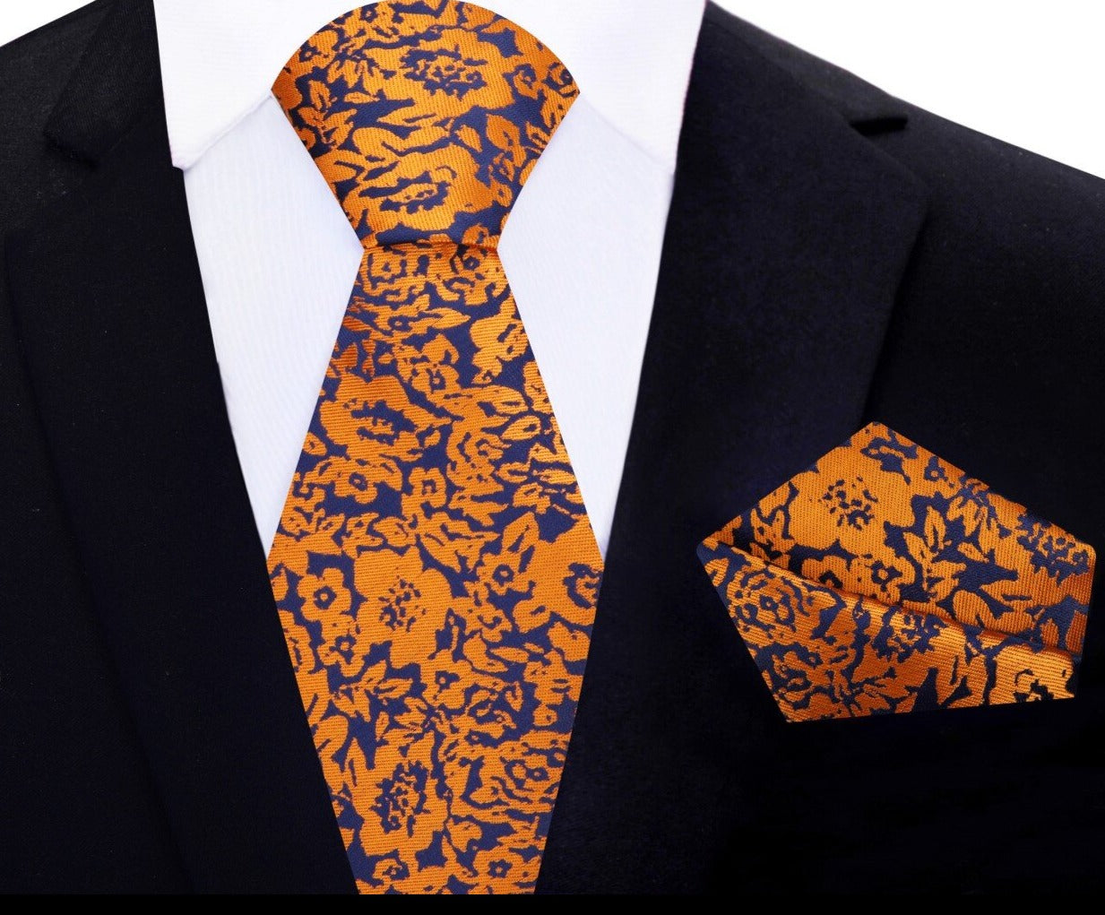 A deep blue and rusty orange floral tie and pocket square