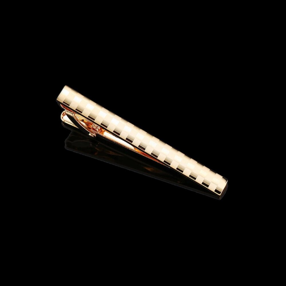 A Gold Colored Checkered Pattern Tie Bar