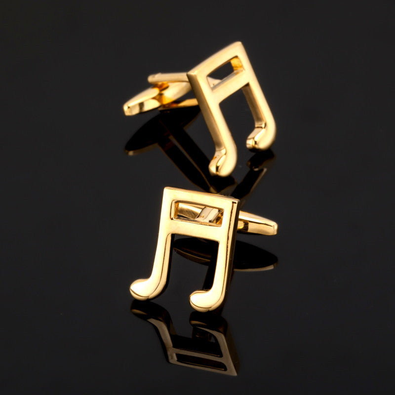 A Gold Colored Music Bar Shape Cuff-links Set.