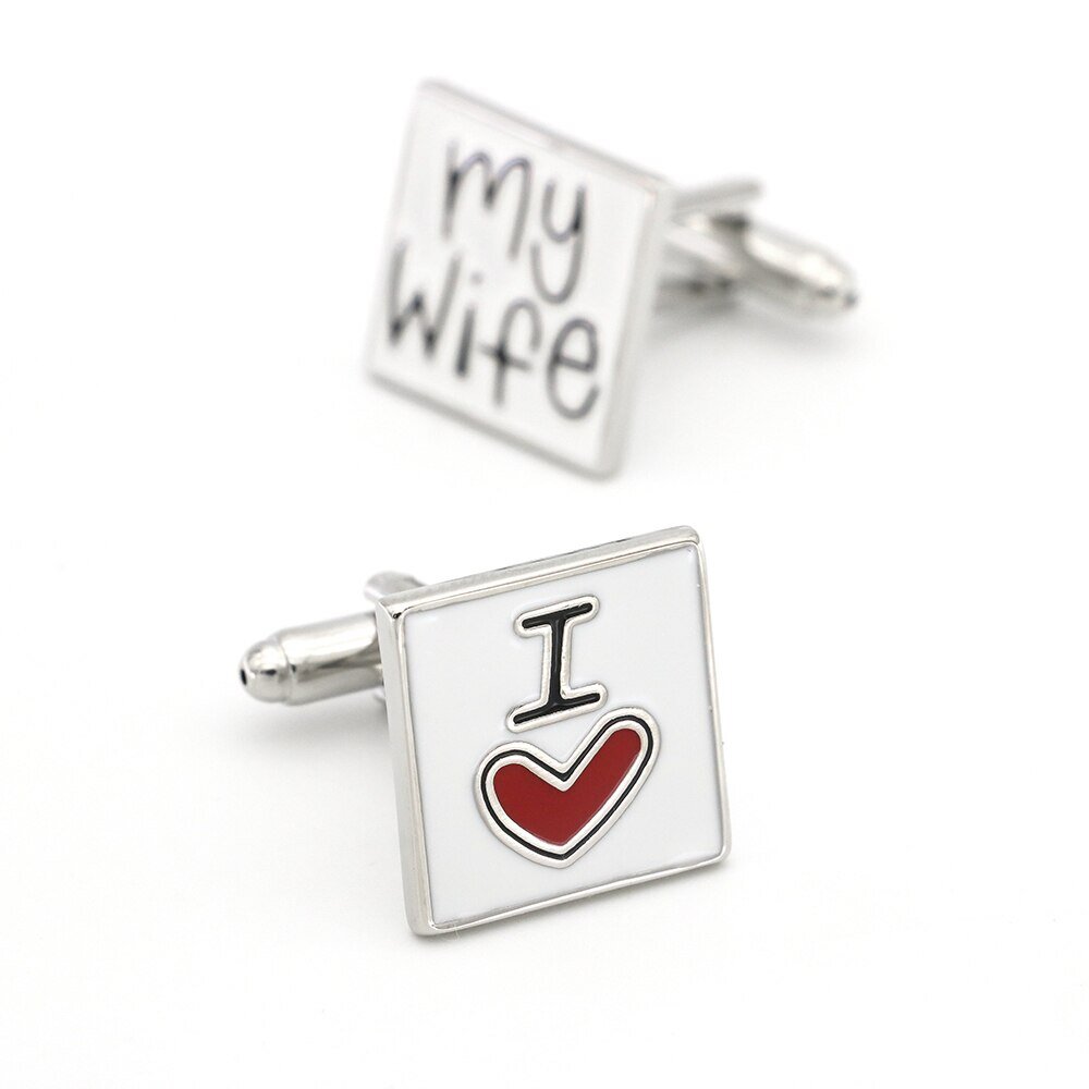 A rectangle shape red, black, white colored with writing "I heart shape my wife" cuff-links.