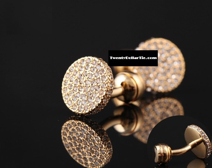 A circular shape gold and clear stone colored cuff-links||Gold